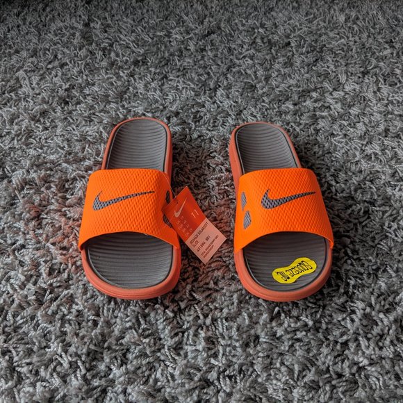 neon orange nike slides